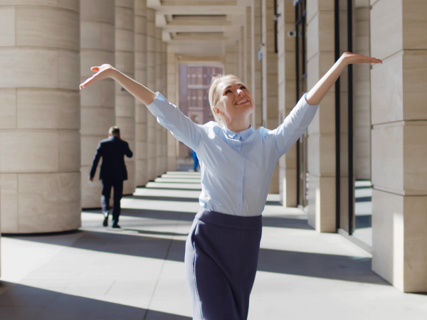 picture of female office worker celebrating a promotion